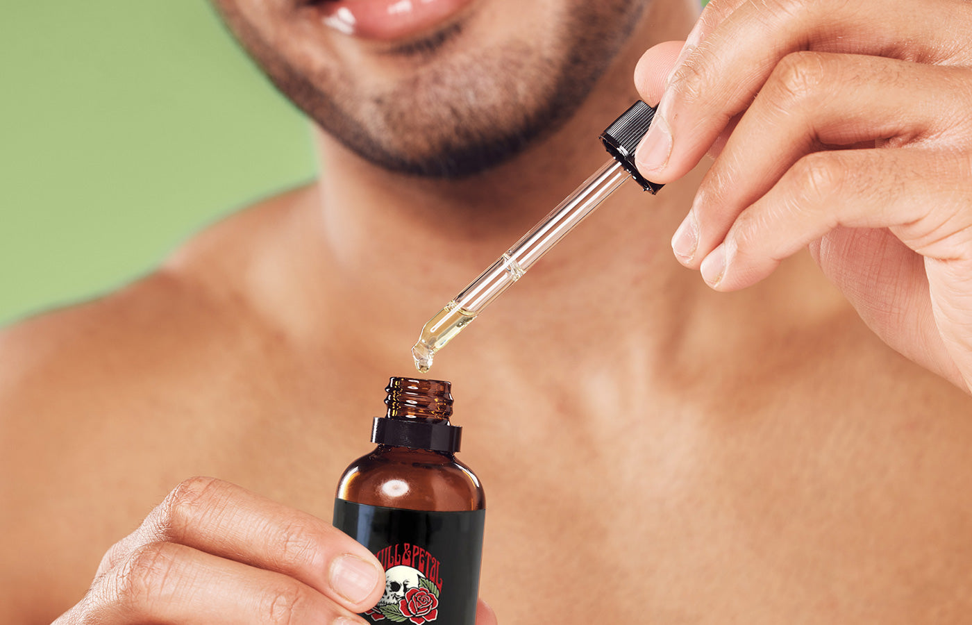 Person using glycolic acid dropper